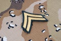 May 12, 2018. US ARMY Corporal rank patch on desert camouflage uniform background