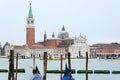 Close up of San Giorgio Maggiore church with ships transporting people around it