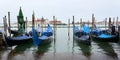 Panoramic view of San Giorgio Maggiore church with ships transporting people around it and gondolas in the foreground