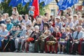 May 9. Victory Day. Older men, veterans of the war, sitting with medals and flowers