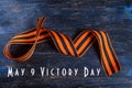 9 may victory day. St. George ribbon on a wooden background