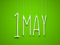 1 may - white word suspended by ropes on green background. Illustration for the may holidays