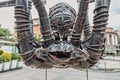 Creepy and funny sculpture of a giant spider made of metal parts. The concept of arachnophobia and