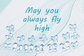 May you always fly high message with blue glass butterflies on blue watercolor paper