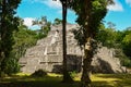 Maya ruin sorrounded by jungle in Yaxha