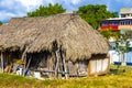 Mayan huts wooden cottage in tropical jungle beach entrance Mexico