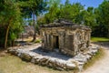 Mayan ruins in shadow of trees in jungle tropical forest Playa del Carmen, Riviera Maya, Yu atan, Mexico Royalty Free Stock Photo