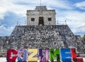 Mayan Temple and colorful Cozumel Sign on the island of Cozumel, Mexico Royalty Free Stock Photo