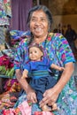 Mayan woman in traditional clothing holding a doll Royalty Free Stock Photo