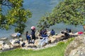 Mayan women wash clothes in San Antonio PalopÃÂ³ Lake Atitlan Guatemala.