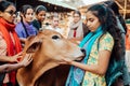 Mayapur, West Bengal, India - February 7, 2020. multinational group of teenage girls on a field trip to the Indian cow farm Royalty Free Stock Photo