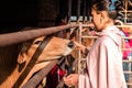 Mayapur, West Bengal, India - February 7, 2020. multinational group of teenage girls on a field trip to the Indian cow farm Royalty Free Stock Photo