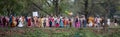 Mayapur, West Bengal, India - March 5, 2020. international group of pilgrims in national clothes sari and dhoti perform