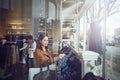 Maybe I should try something different. a young woman shopping at a clothing store.