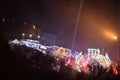 Mayen, Germany - 10 17 2023: Lights of the Lukasmarkt with fast spinning carousels and a y of light straight up Royalty Free Stock Photo