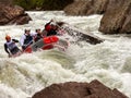 Rafting, brave and courageous people conquer water obstacles on a mountain river on rafts.