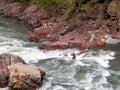 Rafting, brave and courageous people conquer water obstacles on a mountain river on rafts.