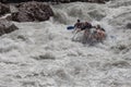 Rafting, brave and courageous people conquer water obstacles on a mountain river on rafts, along the river, in the spring.