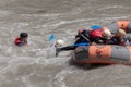 Rafting, brave and courageous people conquer water obstacles on a mountain river on rafts.