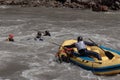 Rafting, brave and courageous people conquer water obstacles on a mountain river on rafts.