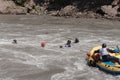 Rafting, brave and courageous people conquer water obstacles on a mountain river on rafts.