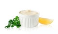Mayonnaise bowl with lemon and parsley isolated on white with clipping path. Design element for product label, print. Royalty Free Stock Photo