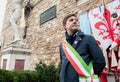 The mayor of Florence with mayoral sash standing near Palazzo Vecchio