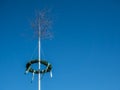 Maypole on blue background bavaria