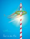 maypole with colorful ribbons on blue sunny sky background