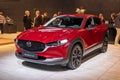 Mazda CX-30 hybrid compact SUV car at the Brussels Autosalon European Motor Show. Brussels, Belgium - January 13, 2023 Royalty Free Stock Photo