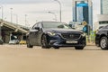 Mazda 6 is driving along the street in city with blurred background. Front side view rolling shot with Mazda6 third generation in