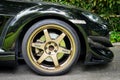 A Mazda RX8 is wearing Volk Rays TE37 Golden 18 inches Rim.