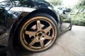 A Mazda RX8 is wearing Volk Rays TE37 Golden 18 inches Rim.