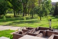 A maze of brown  wooden walls, a green-yellow autumn park Royalty Free Stock Photo