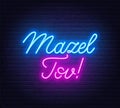 Mazel Tov neon lettering on brick wall background. Royalty Free Stock Photo