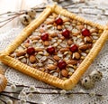 Mazurek pastry, traditional Polish Easter cake made of shortcrust pastry, fudge caramel cream, candied fruit and almonds, closeup