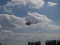 Mbb bolkow blohm helicopter of the coast guard performing stunts during the philippine hot air balloon festival in clark pampanga