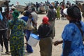 Crowds of sardinella fishers and fish buyers at Mbour landing site, Senegal