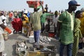 Crowds of sardinella fishers and fish buyers at Mbour landing site, Senegal