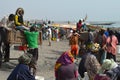 Crowds of sardinella fishers and fish buyers at Mbour landing site, Senegal