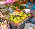 MBour, Senegal, AFRICA - April 22, 2019: Unidentified Senegalese woman selling fruits in her stall.Street fruit market where