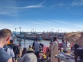 MBour, Senegal- April 25 2019: Unidentified Senegalese men and women at the fish market in the port city near Dakar. There are