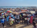 MBour, Senegal- April 25 2019: Unidentified Senegalese men and women at the fish market in the port city near Dakar. There are