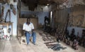 Mbour, Senegal, handcrafts seller posing inside his small souvenir shop