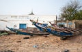 Mbour, Senegal: Colourful fishing boats stranded in the sand
