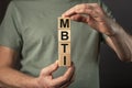 MBTI acronym, inscription on wooden dices. Types of personalities concept