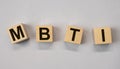 MBTI acronym, letters on wooden dices. Psychology concept