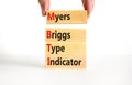 MBTI Myers Briggs type indicator symbol. Concept words MBTI Myers Briggs type indicator on block on beautiful white background.