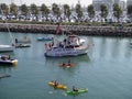 McCovey Cove fill with kayaks, boats, and people having fun, one