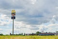 McDonald logo on board against blue sky Royalty Free Stock Photo